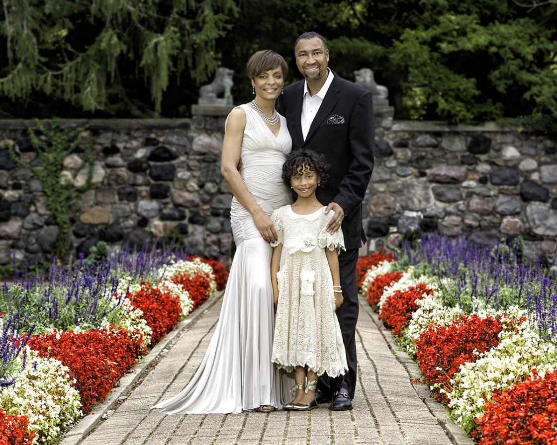 Photograph of a family in the Sunken Garden.