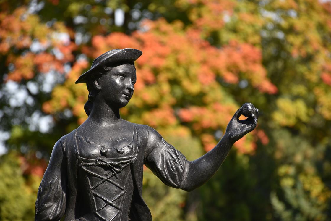 Photograph of The Shepherdess at Cranbrook Gardens will fall colors in the background. 