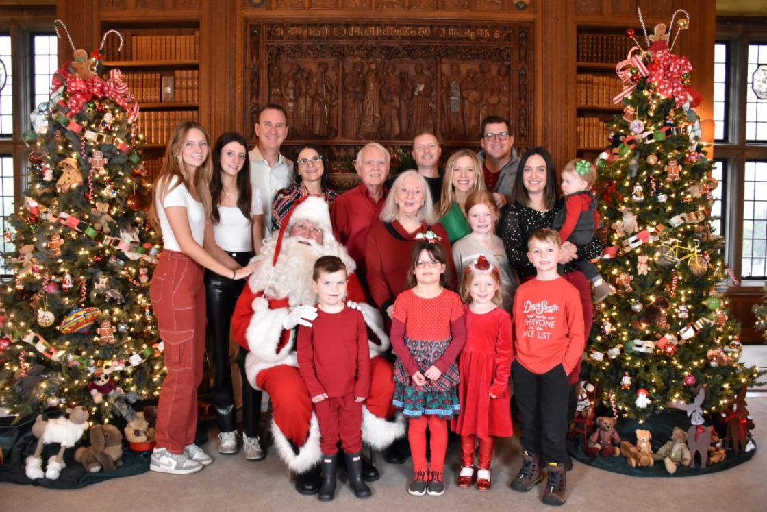 Photo of a family visiting Santa in the Cranbrook House Library.