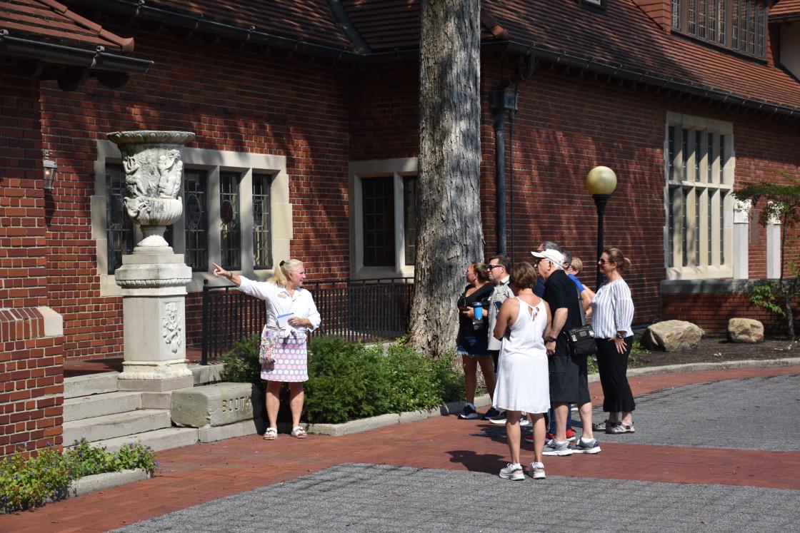 Photograph of a volunteer leading a tour at Cranbrook House & Gardens.